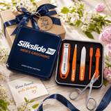 SilkslidePro Men’s Grooming Set in schwarzer Metallbox neben Blumen und Pflegeaccessoires